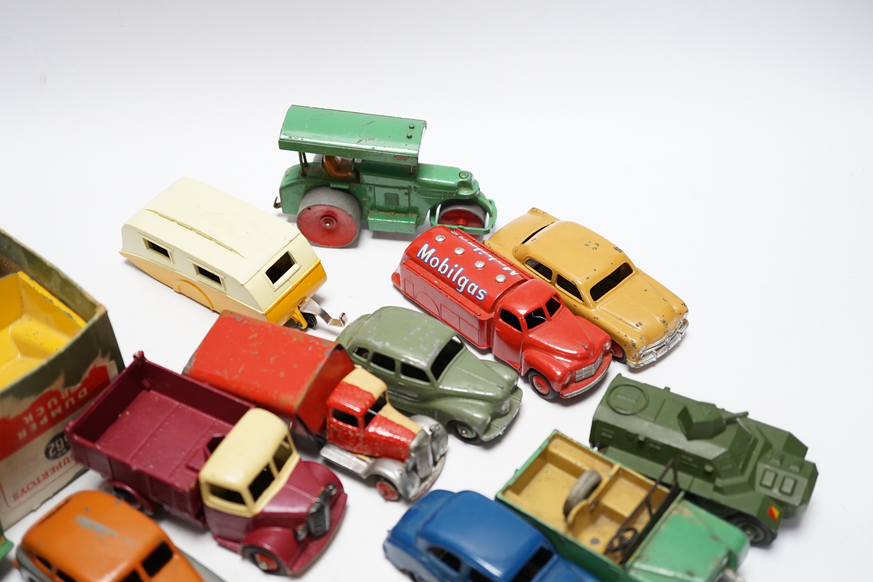 Nineteen Dinky Toys including; Mobilgas Tanker, Ford Sedan, Austin Devon, Austin Somerset, Standard Vanguard, Bedford Tipper, Hudson Sedan, etc.